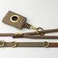 brown canvas dog poo bag holder and brown dog collar and brown rope dog lead